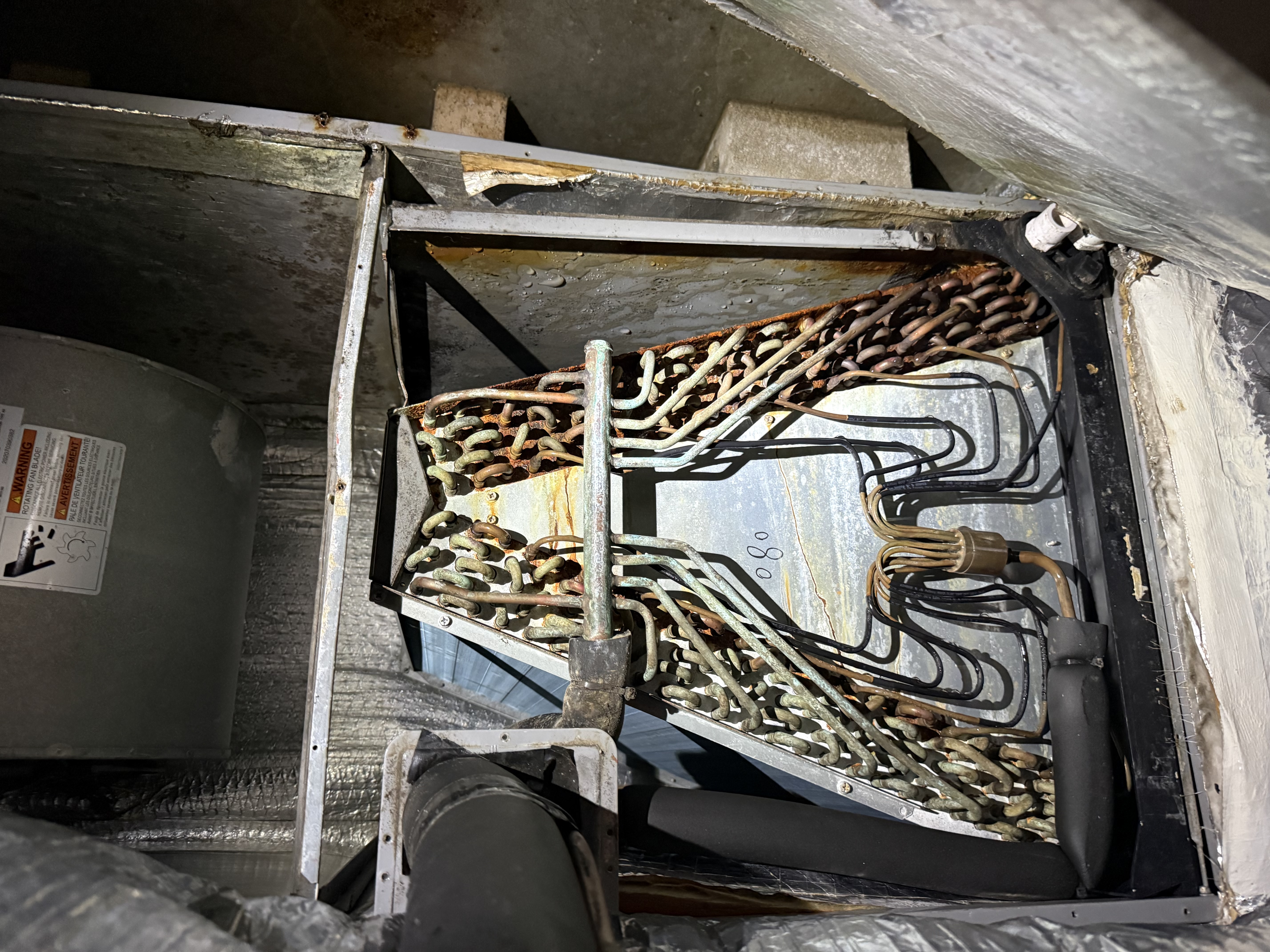 Matador technician repairing outdoor heating unit in San Antonio